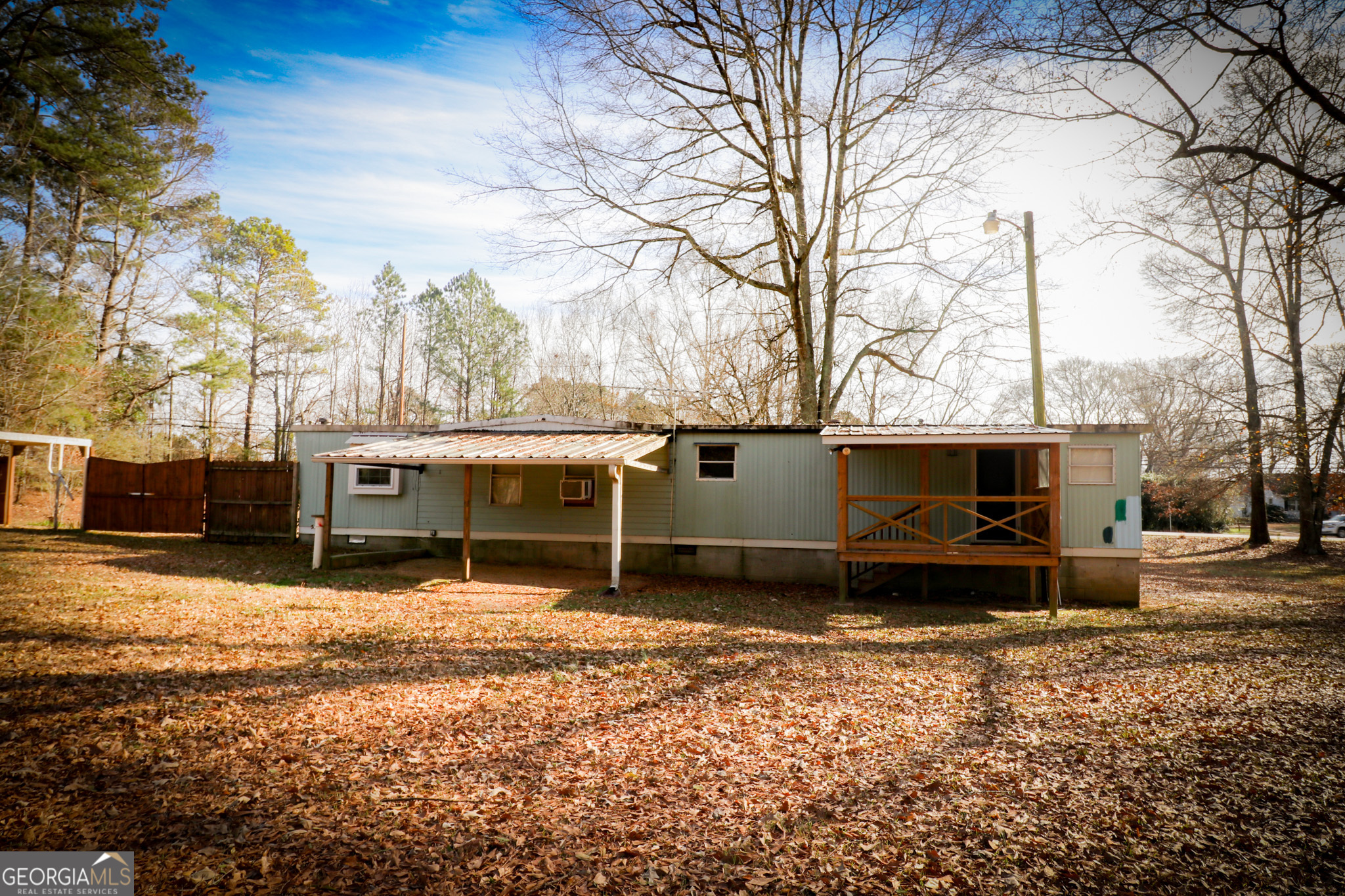 2447 Williamson Road Williamson, GA 30292 - Photo 70 of 95 a view of a house with a yard covered in snow