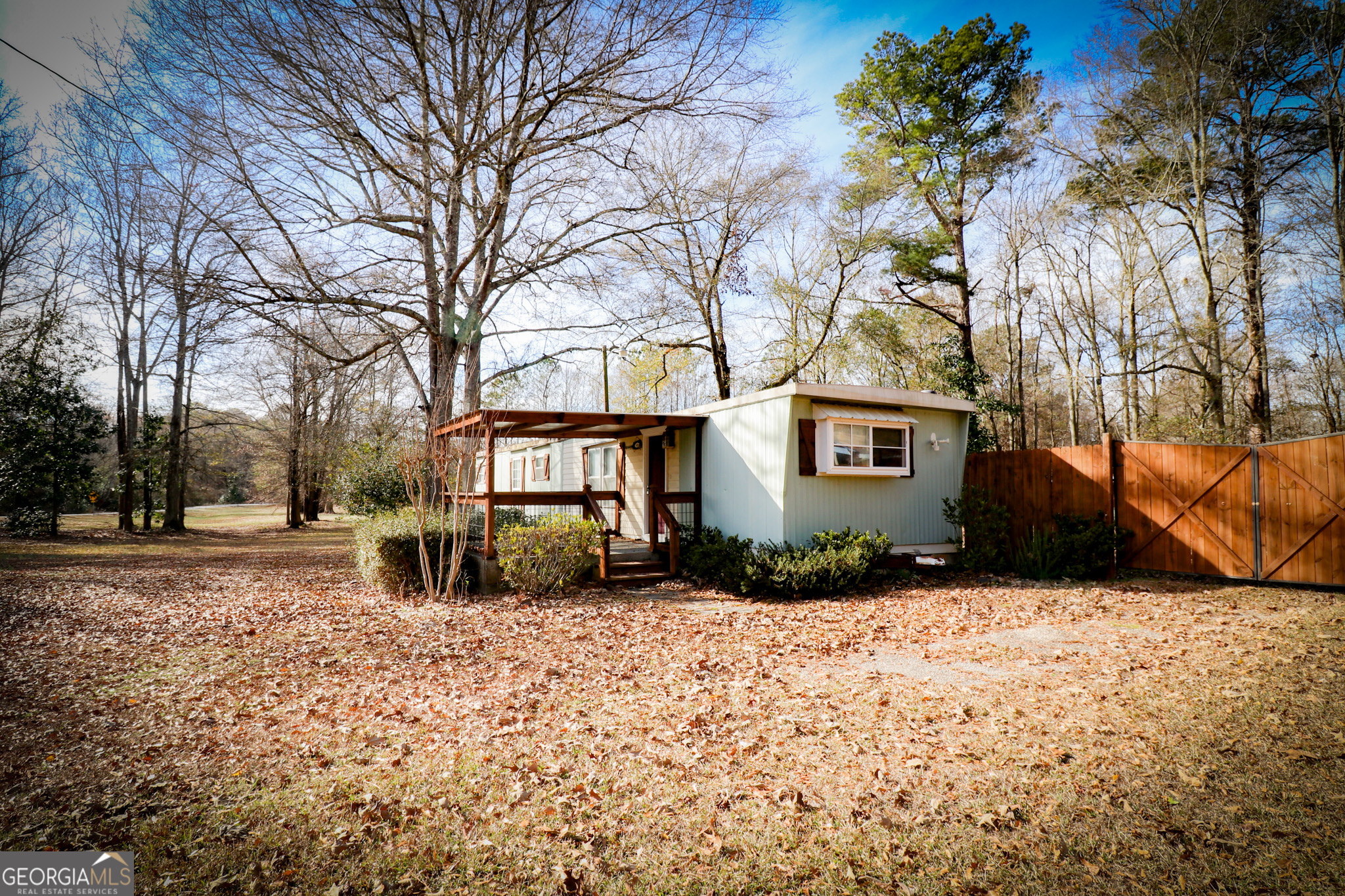 2447 Williamson Road Williamson, GA 30292 - Photo 7 of 95 a view of a house with a snow in the yard