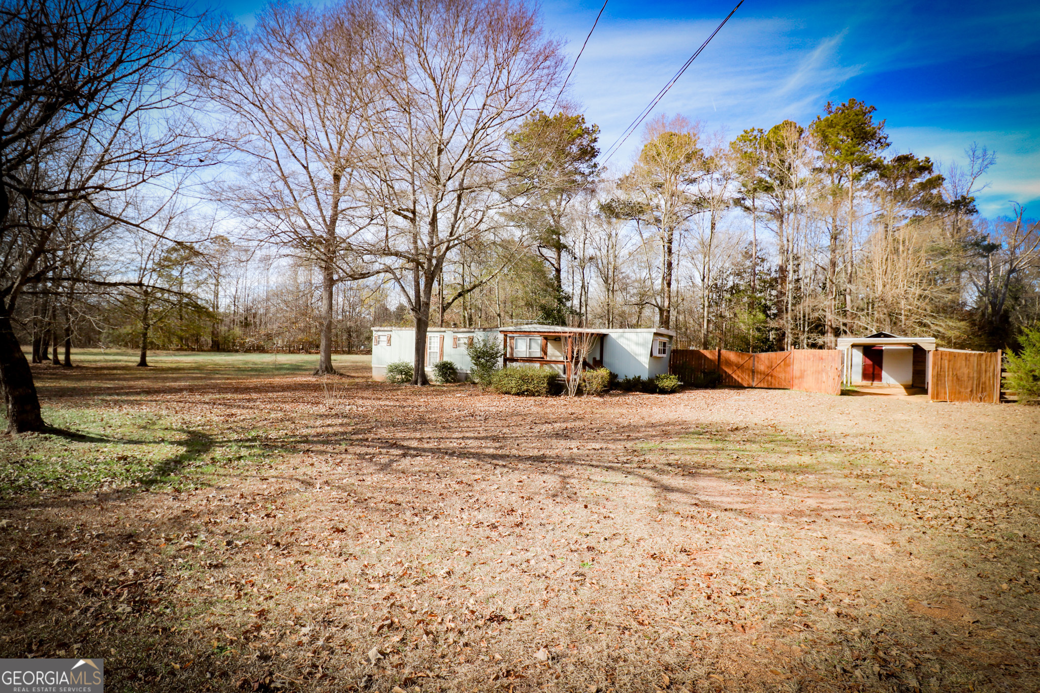 2447 Williamson Road Williamson, GA 30292 - Photo 71 of 95 a view of road with large trees
