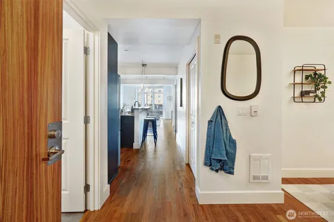 a kitchen with stainless steel appliances granite countertop a sink refrigerator and microwave