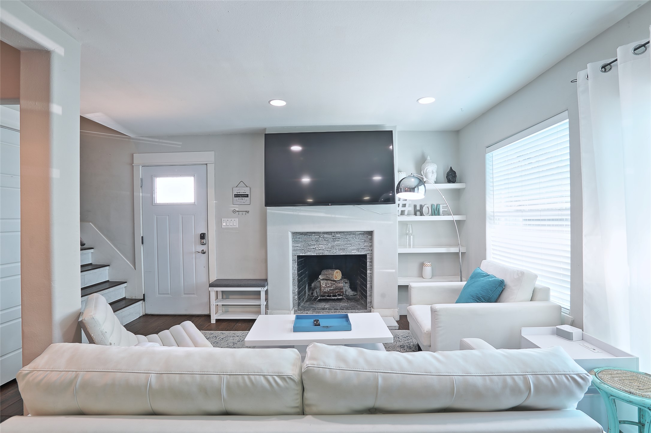 4804 West Wind Trail, Unit 101 Austin, TX 78745 - Photo 12 of 24 a living room with furniture and a fireplace