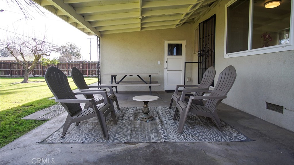 701 Williams Avenue Madera, CA 93637 - Photo 17 of 20 a view of a patio with table and chairs