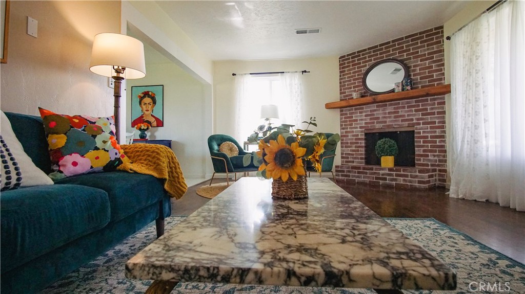 701 Williams Avenue Madera, CA 93637 - Photo 5 of 20 a living room with furniture and a fireplace
