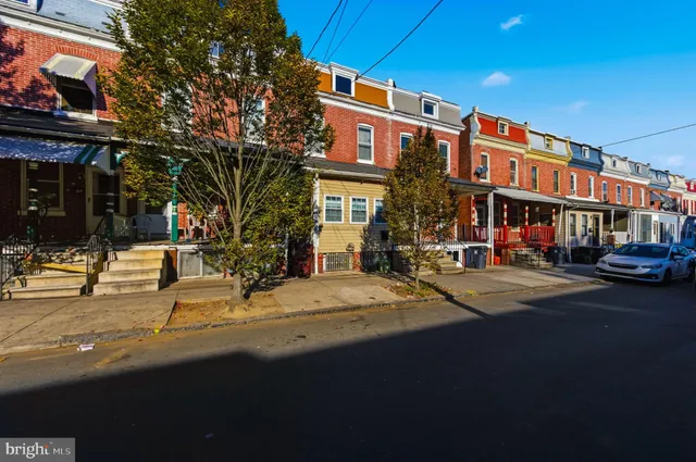 a front view of a building with street view