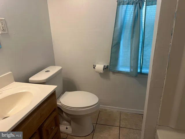 a bathroom with a toilet and a sink