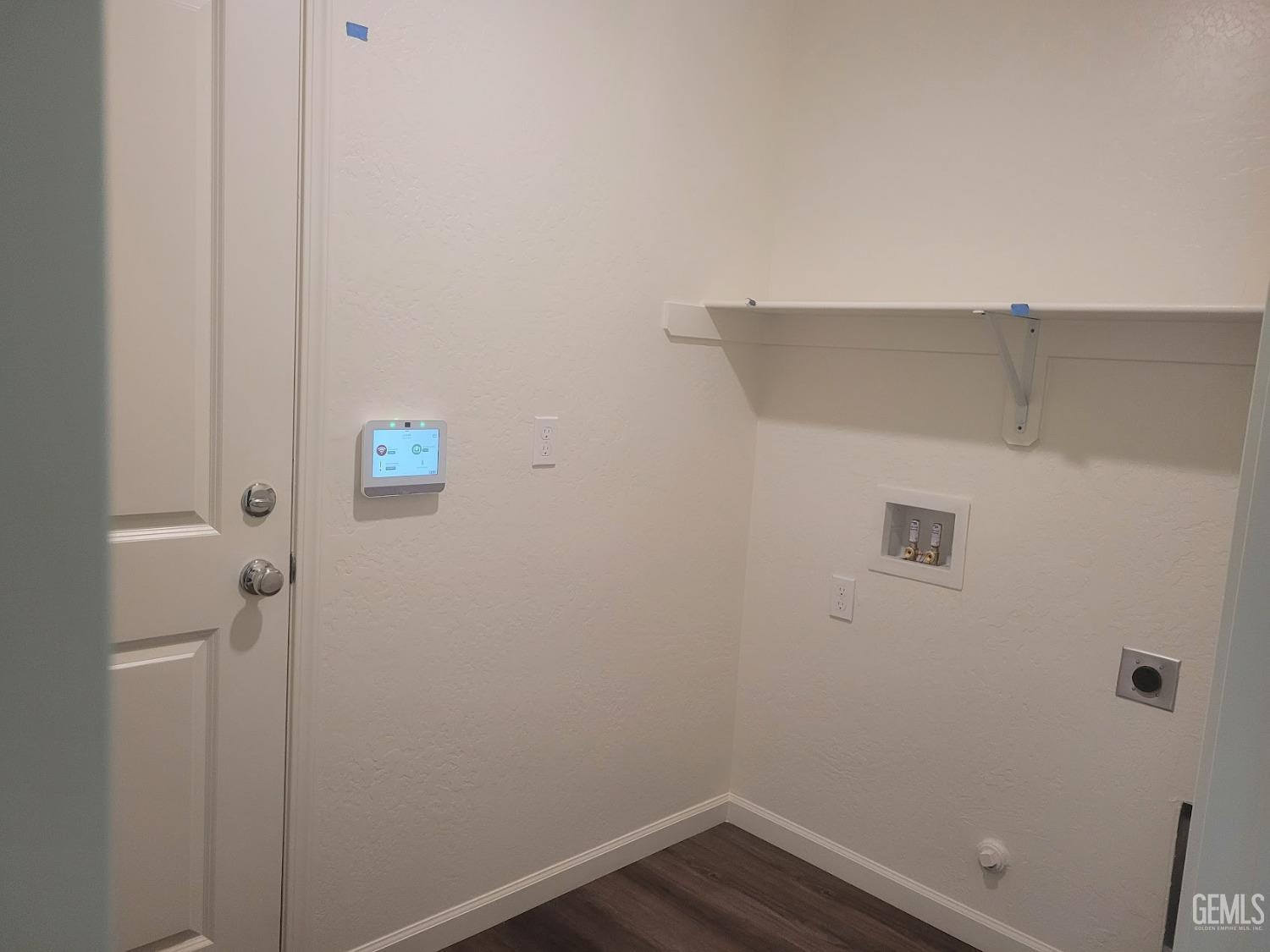 Undisclosed Address Bakersfield, CA 93307 - Photo 13 of 24 a view of small space with racks on the wall