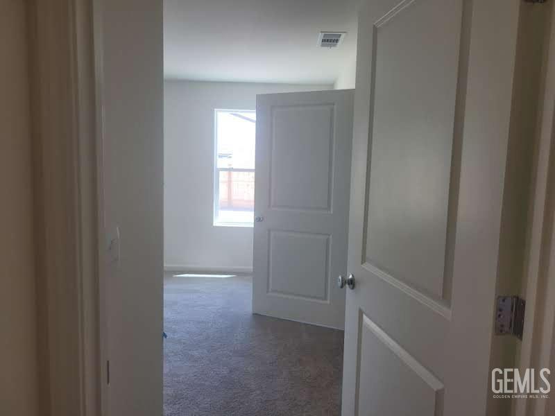Undisclosed Address Bakersfield, CA 93307 - Photo 18 of 24 a view of hallway with window