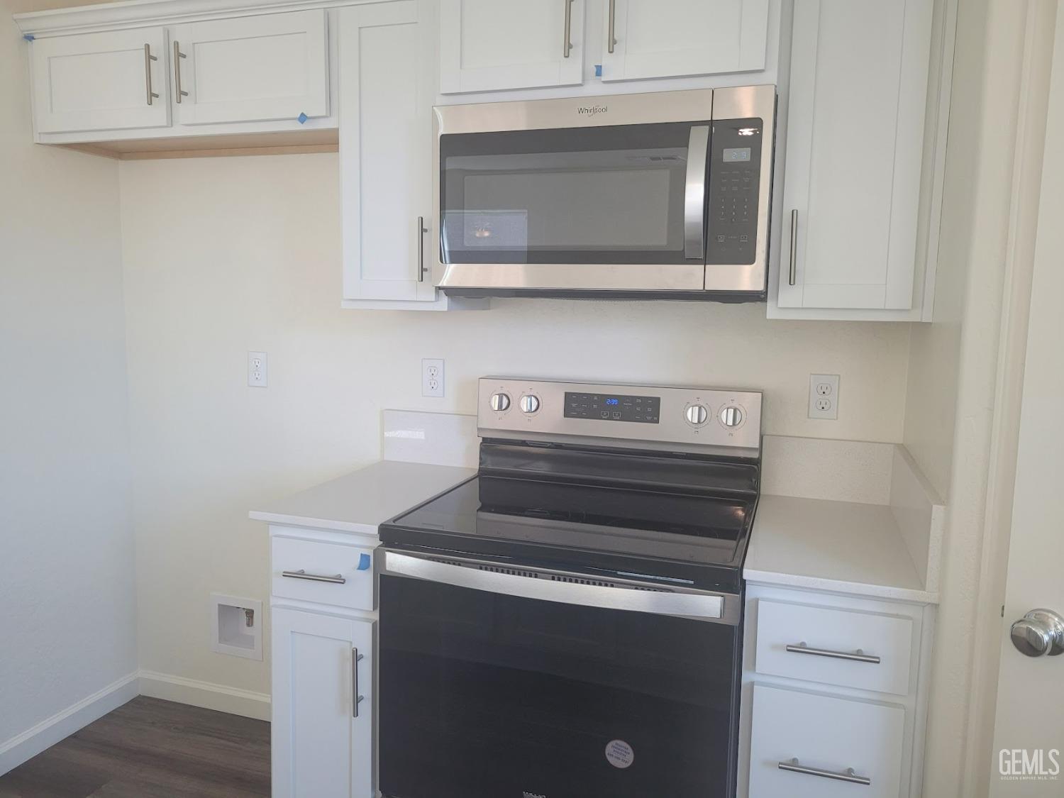 Undisclosed Address Bakersfield, CA 93307 - Photo 8 of 24 a kitchen with a stove and a microwave