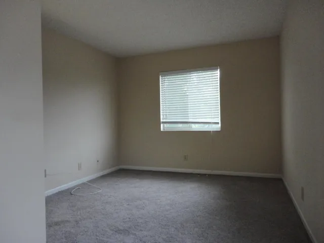 a bathroom with a toilet and a bath tub