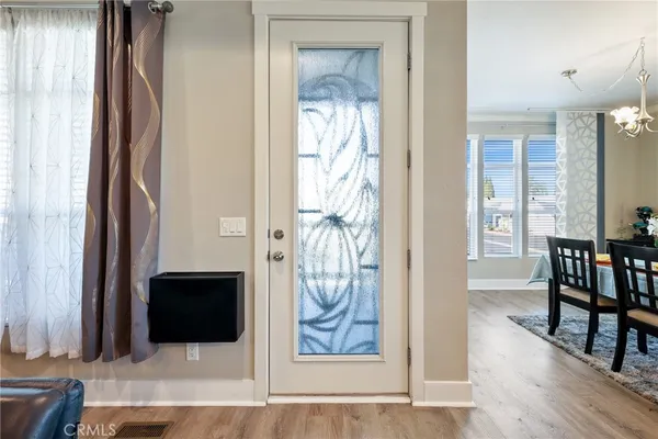 a view of a livingroom with furniture and entryway