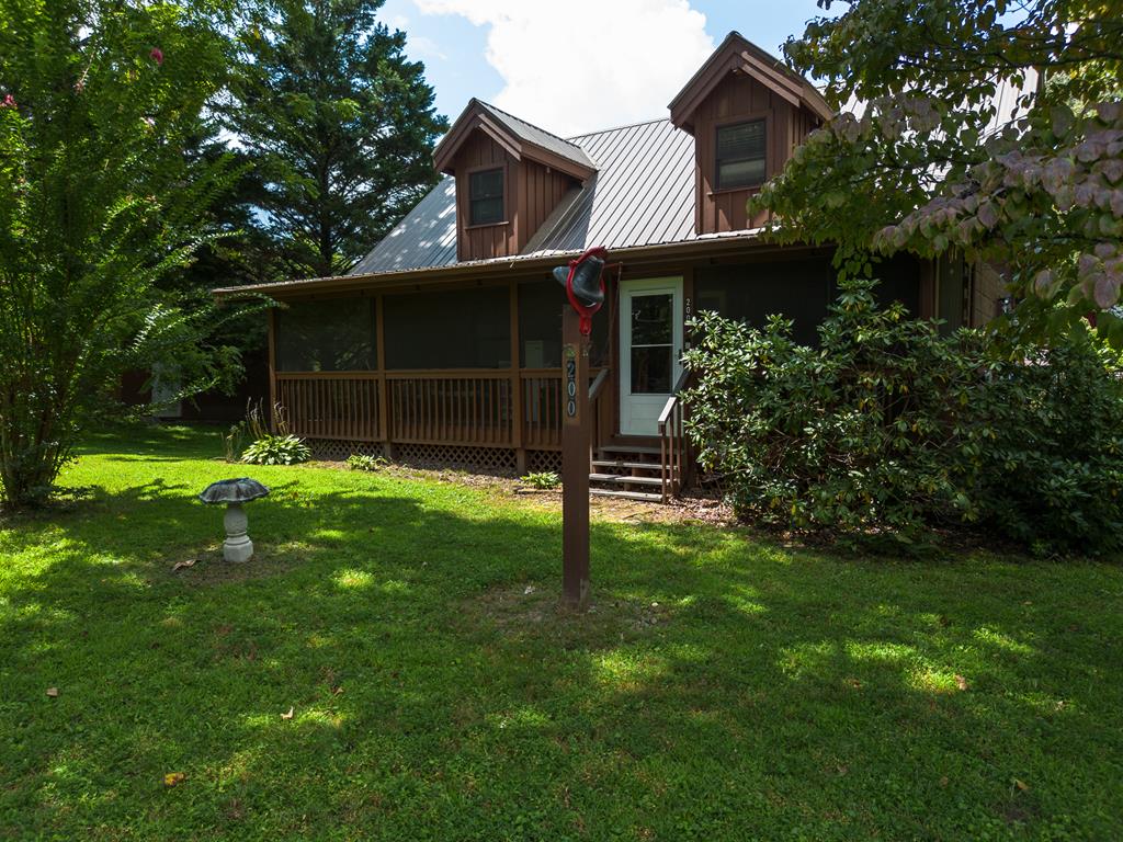 200 Lickskillet Road Epworth, GA 30541 - Photo 1 of 51 a backyard of a house with plants and large tree