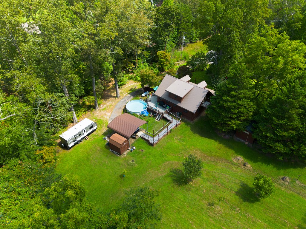 200 Lickskillet Road Epworth, GA 30541 - Photo 18 of 51 an aerial view of a house with a yard table and chairs