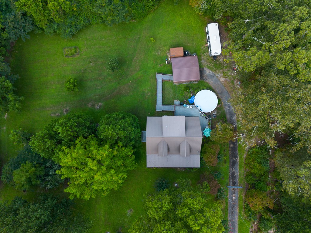 200 Lickskillet Road Epworth, GA 30541 - Photo 28 of 51 a aerial view of a house with a swimming pool and garden