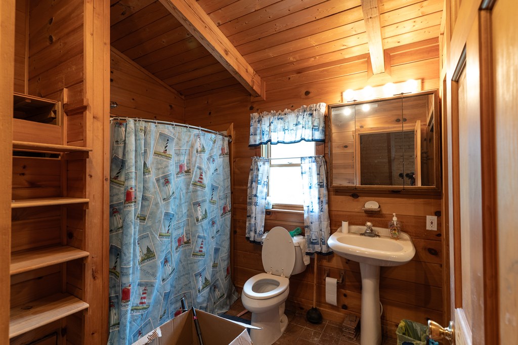 200 Lickskillet Road Epworth, GA 30541 - Photo 45 of 51 a bathroom with a sink toilet and shower
