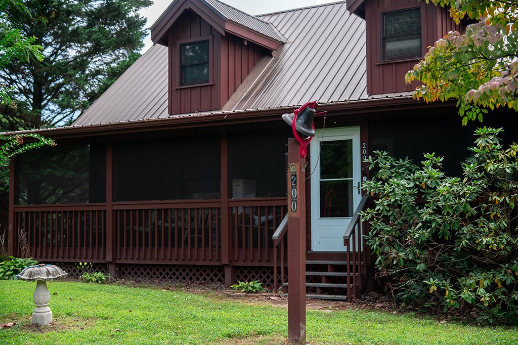 200 Lickskillet Road Epworth, GA 30541 - Photo 10 of 51 a view of a house with a small cabin and a chair
