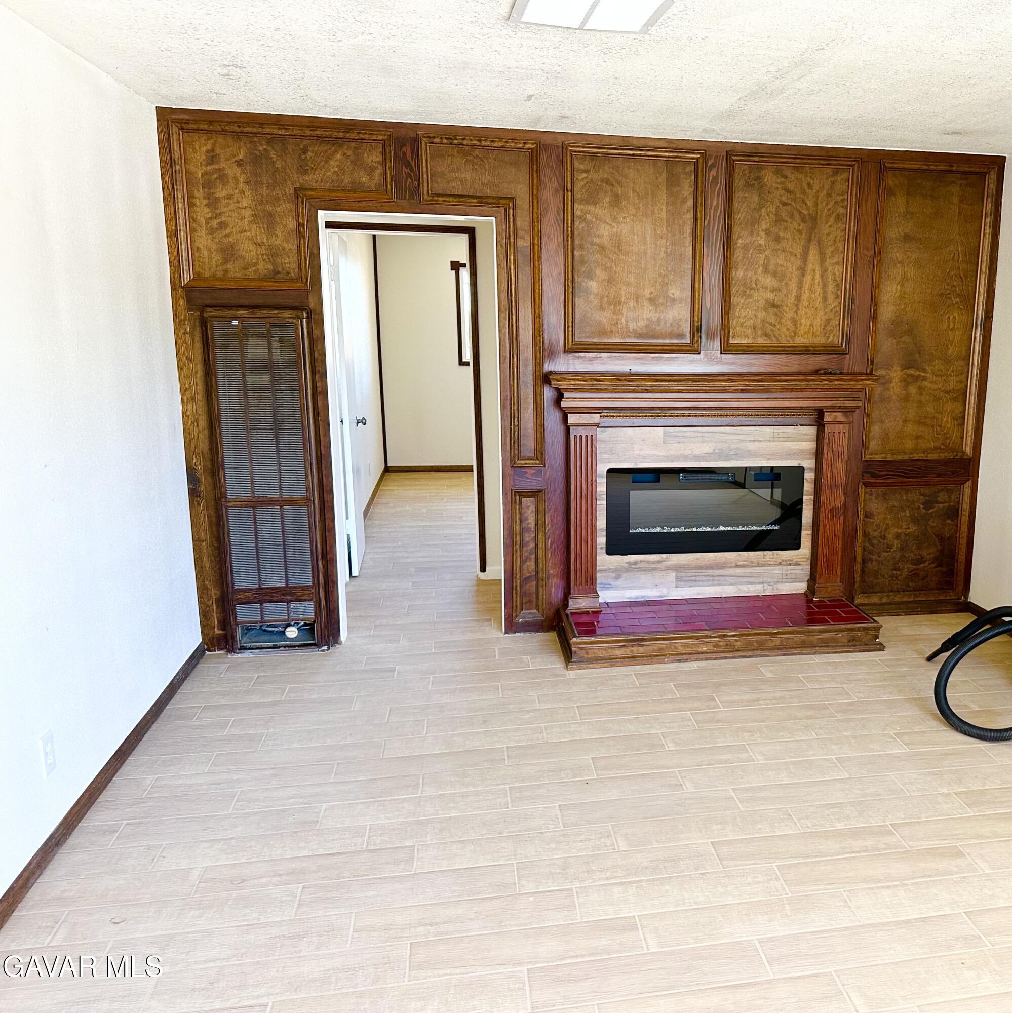 839 East Ave P-12 Palmdale, CA 93550 - Photo 2 of 9 a view of a livingroom with a fireplace