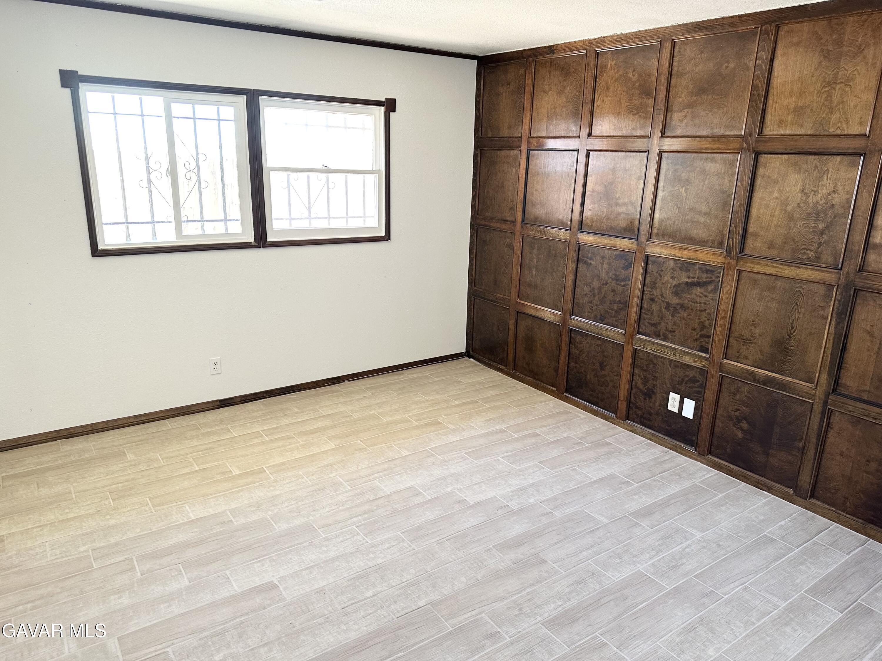 839 East Ave P-12 Palmdale, CA 93550 - Photo 7 of 9 a view of an empty room with a window