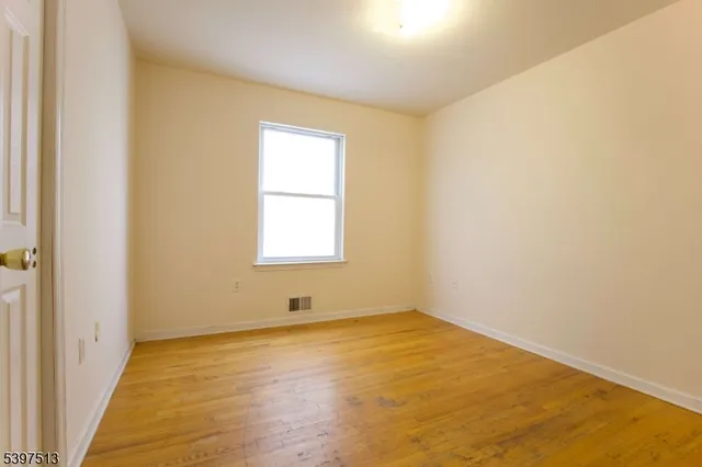 an empty room with closet area