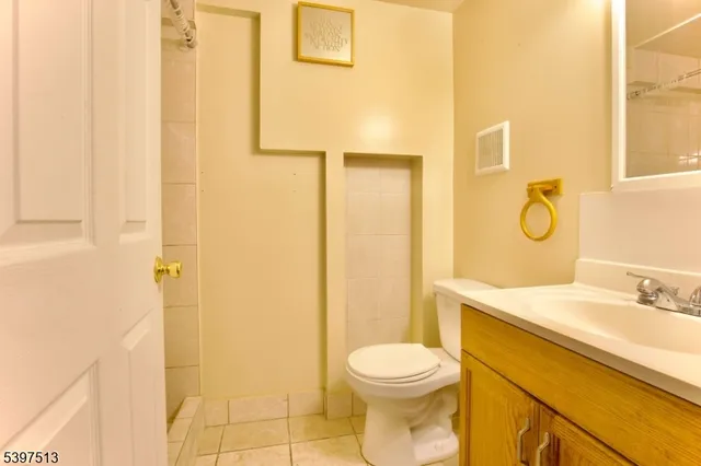 a backyard of a house with a garden and plants