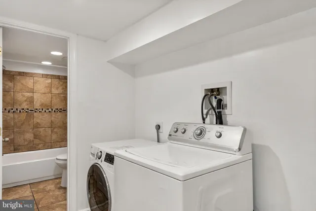 a utility room with dryer and washer