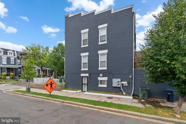 a front view of a building with retail shops