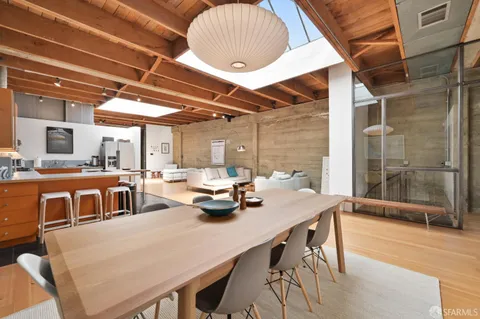 a dining room with a table and chairs