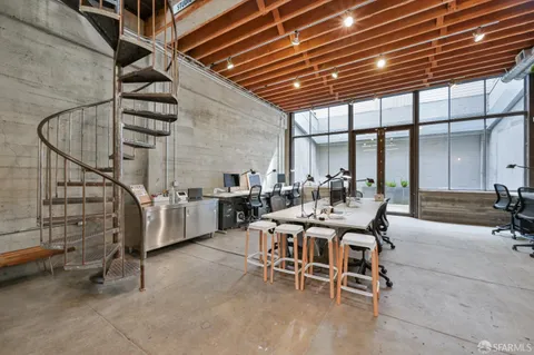 a dining room with furniture and entryway