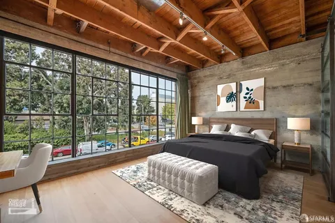 a bedroom with a bed and a couch