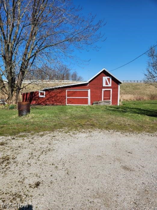 409 Carson Road Ashtabula, OH 44004 - Photo 6 of 20 View of outdoor structure featuring a lawn