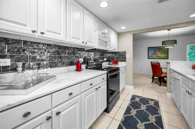 a front view of a house with swing and a garage