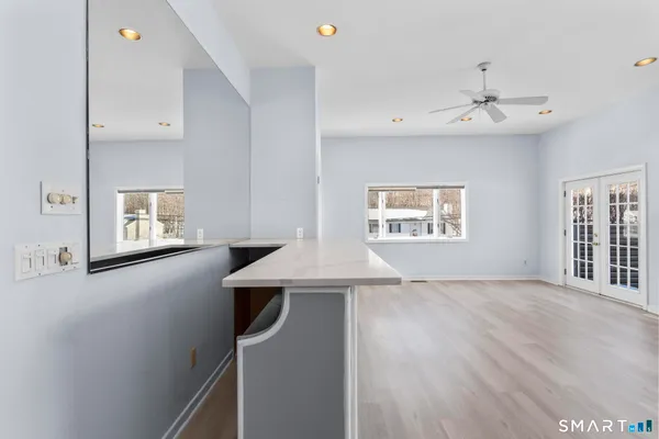 wooden floor in an empty room with a window