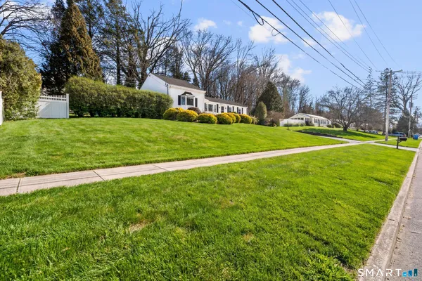 a view of a park with large trees