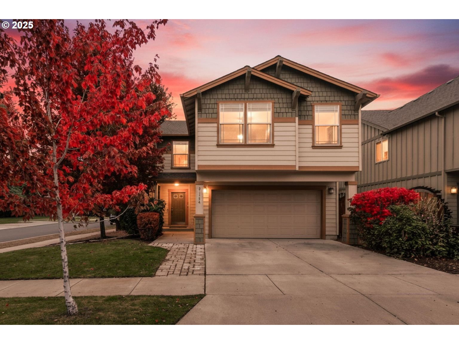 a front view of a house with a garden