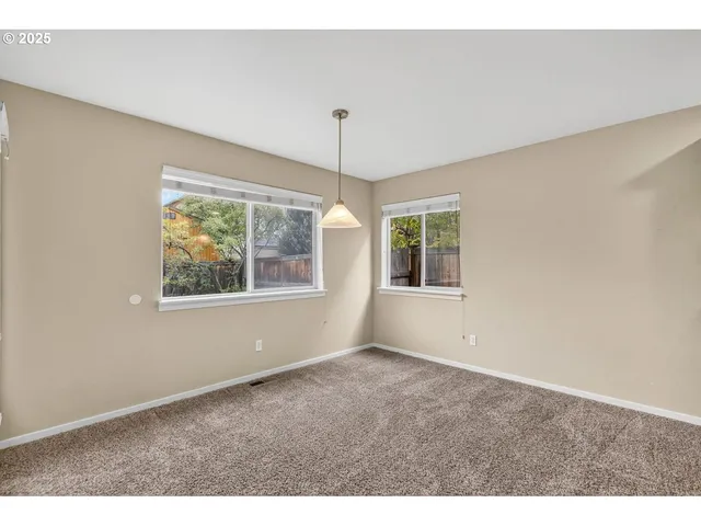 a bathroom with a sink double vanity granite tub shower and a mirror