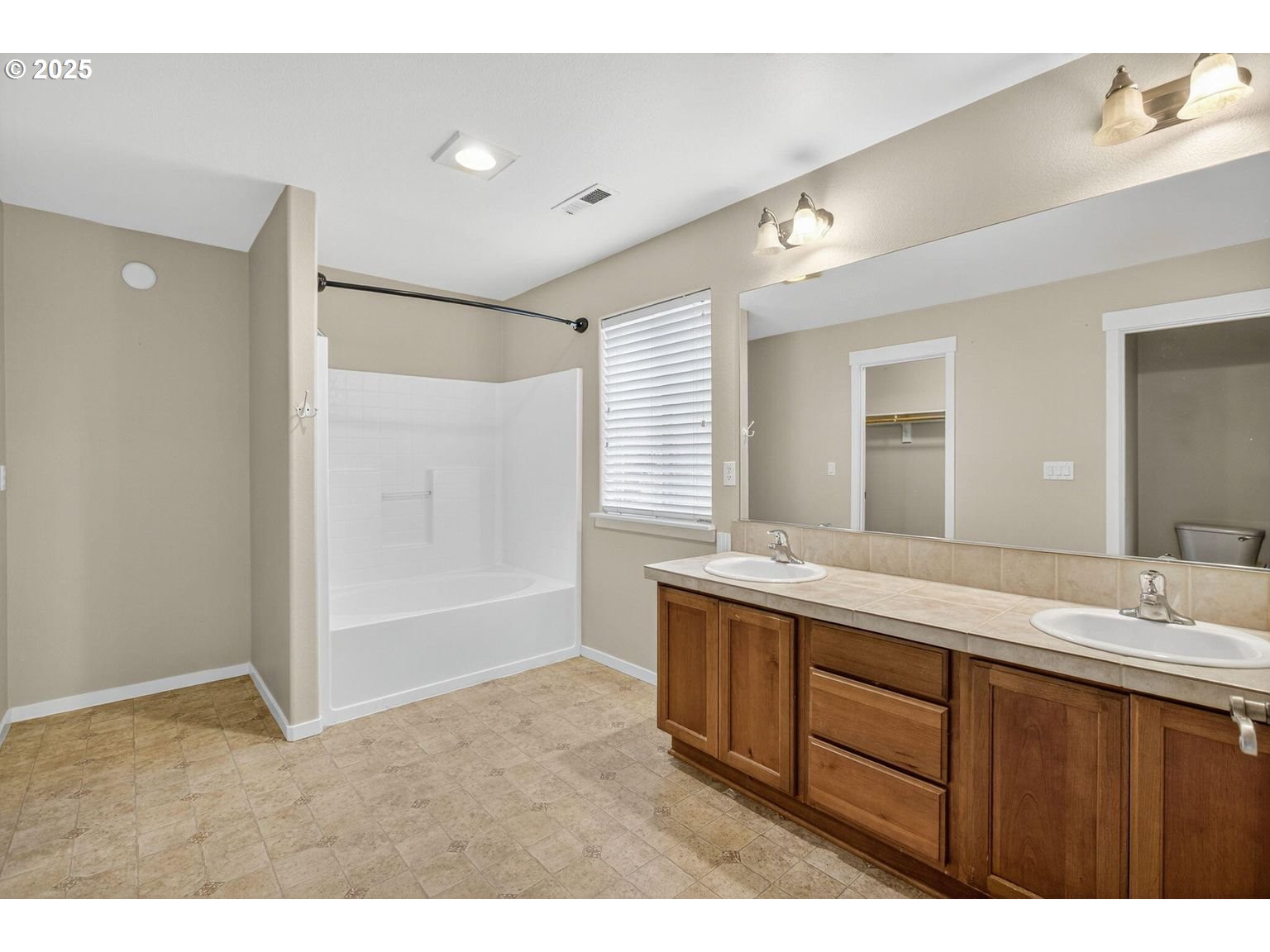 21154 Ritz Place Bend, OR 97702 - Photo 12 of 24 a bathroom with a sink double vanity granite tub shower and a mirror