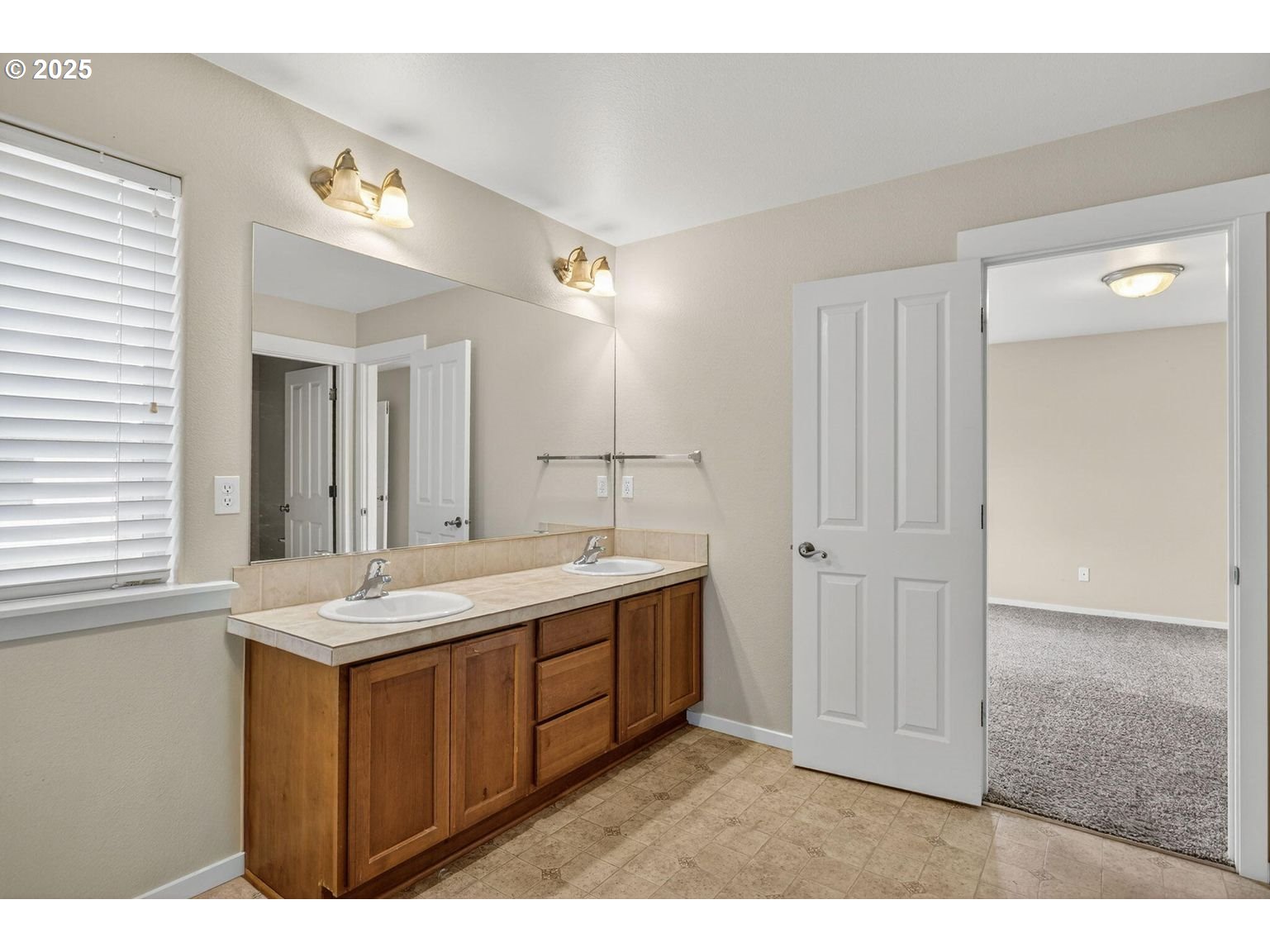 21154 Ritz Place Bend, OR 97702 - Photo 13 of 24 a bathroom with a sink and a mirror