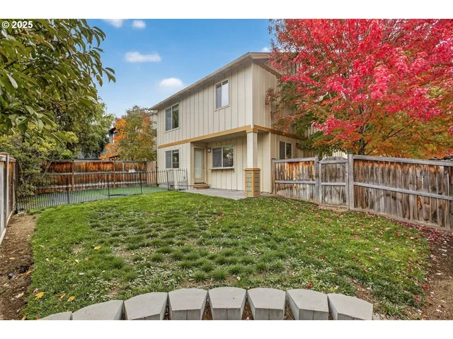 a backyard of a house with lots of green space