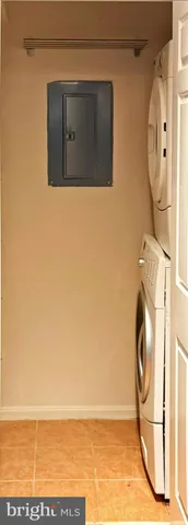 a view of a room with wooden floor and white walls