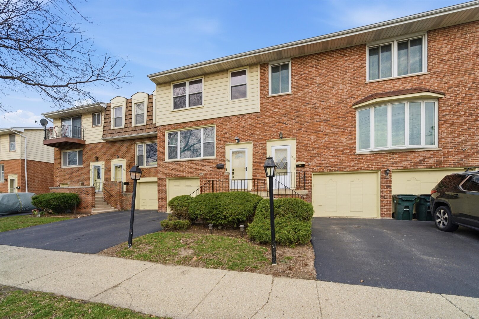 8820 Plainfield Road Brookfield, IL 60513 - Photo 2 of 49 a front view of a house with a yard and car parked