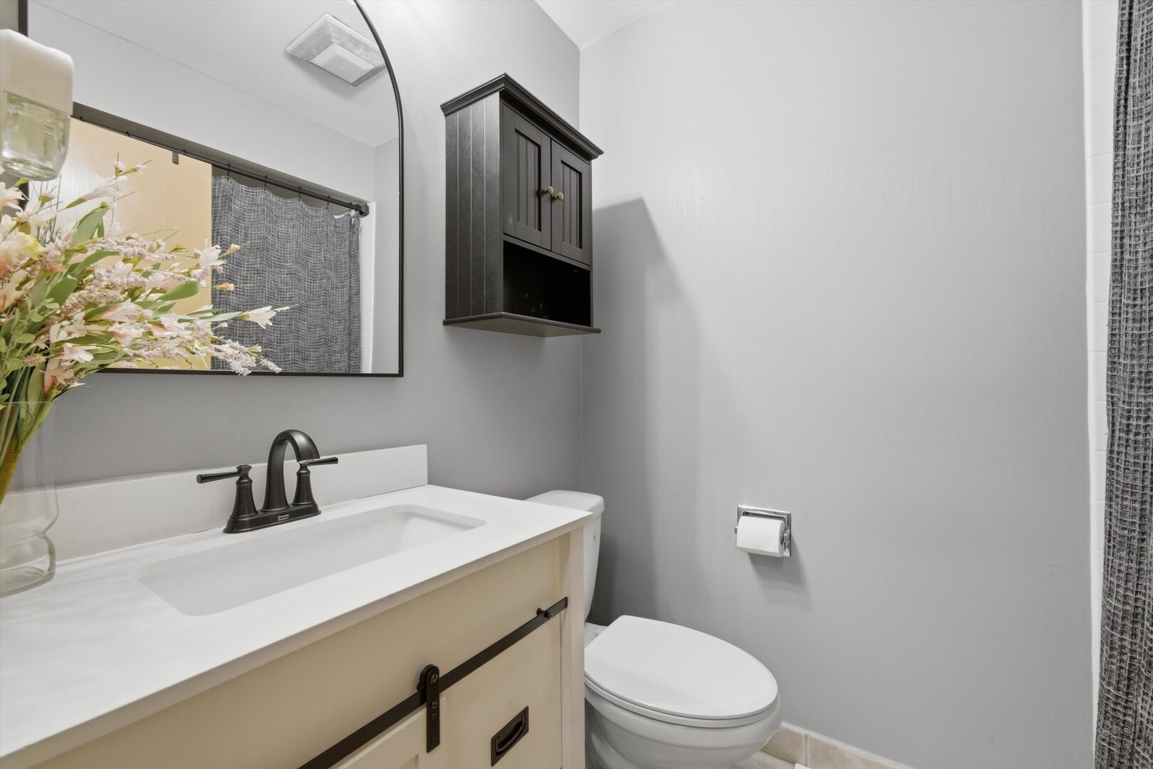 8820 Plainfield Road Brookfield, IL 60513 - Photo 24 of 49 a bathroom with a sink a toilet and mirror
