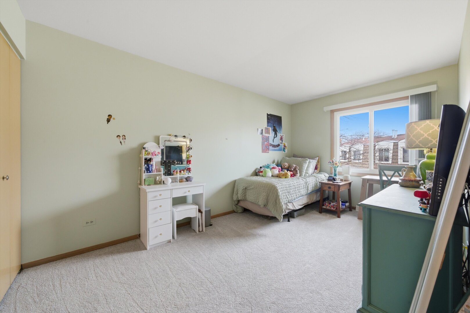 8820 Plainfield Road Brookfield, IL 60513 - Photo 27 of 49 a bedroom with furniture and a flat screen tv