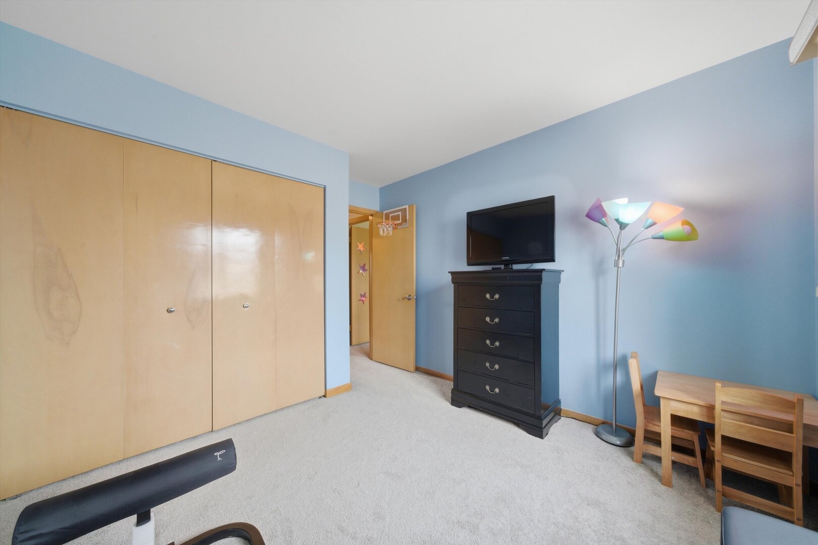 8820 Plainfield Road Brookfield, IL 60513 - Photo 30 of 49 a room with a bed and a television
