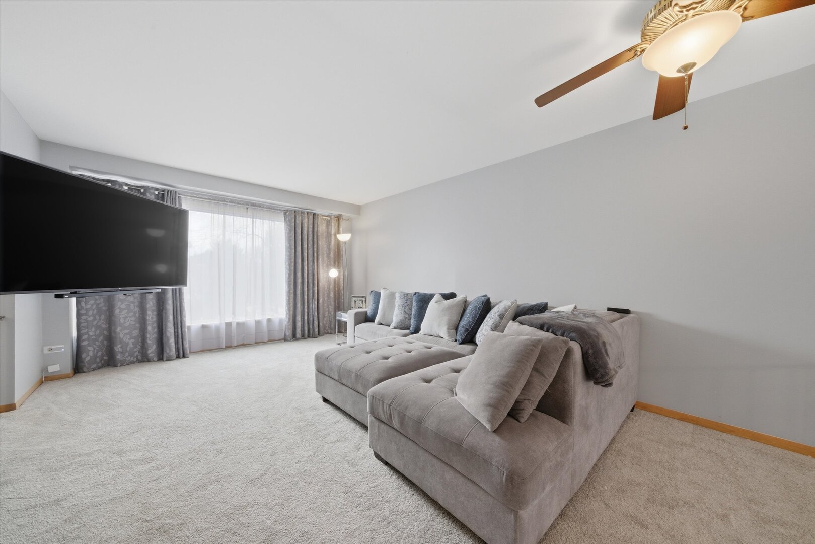 8820 Plainfield Road Brookfield, IL 60513 - Photo 10 of 49 a living room with furniture and a flat screen tv