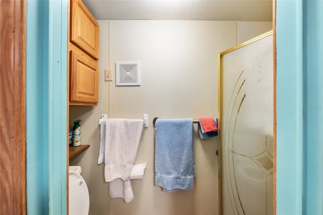 a bedroom with furniture and a chandelier