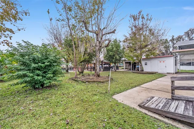 a view of a house with a wooden deck
