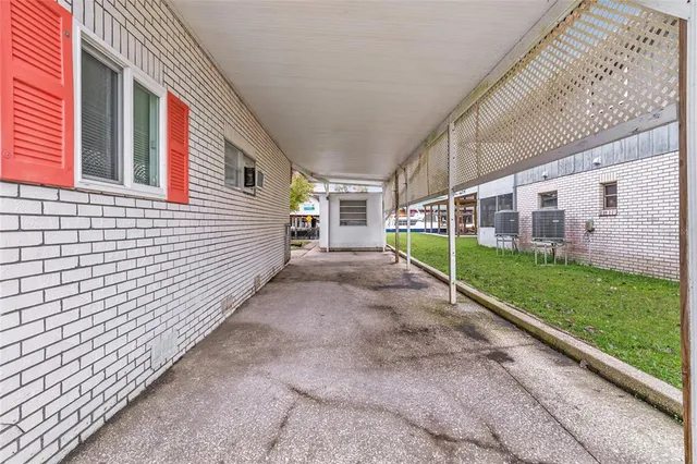 a backyard of a house with table and chairs
