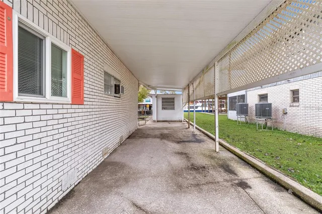 a view of a house with backyard and porch