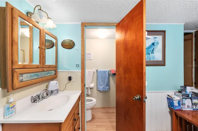 a bathroom with a sink a mirror and a shower