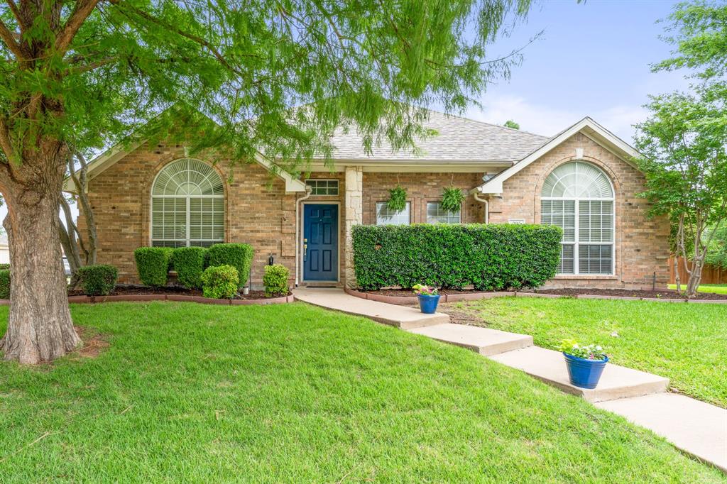 205 Crepe Myrtle Lane Murphy, TX 75094 - Photo 2 of 33 a front view of a house with a yard and trees