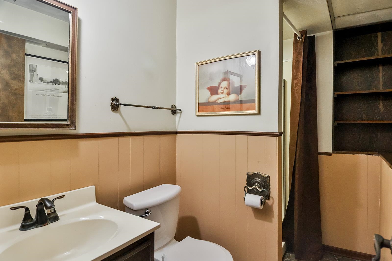 6855 Happy Acres Road Rockford, IL 61101 - Photo 11 of 39 a bathroom with a sink mirror and toilet
